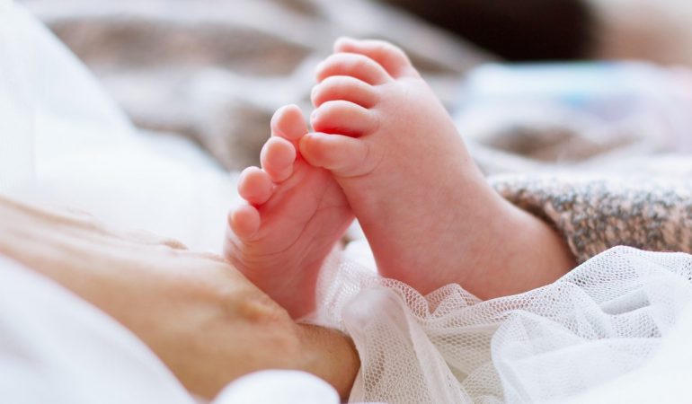 sleeping-baby-is-on-the-bed-VZ8PD7Q